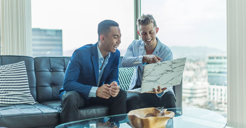 smiling at computer while meeting